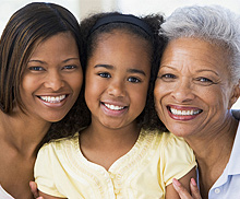 photo of smiling mother and daughter